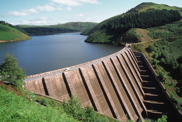 Dam of the Clywedog reservoir - The reservoir is used for supplying drinking water and preventing floods downstream. Water is not taken from the reservoir directly, but is released from the dam during dry periods to ensure that there is a sufficient supply for pumping stations downstream.