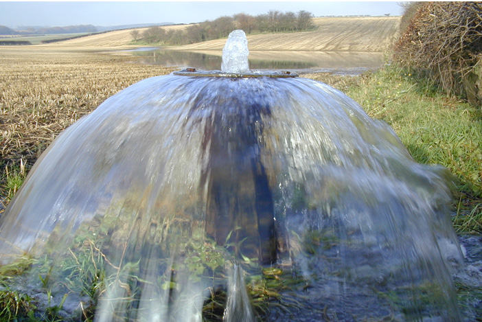 Groundwater - This image is an overflowing artesian observation borehole - Tancred Pit Borehole, Brochdale in the Chalk near Kilham, E. Yorkshire.
